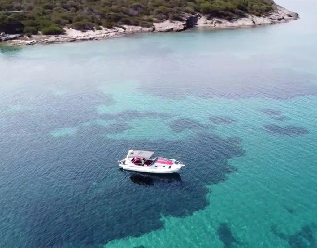 Zen Explorer anchored in a turquoise cove