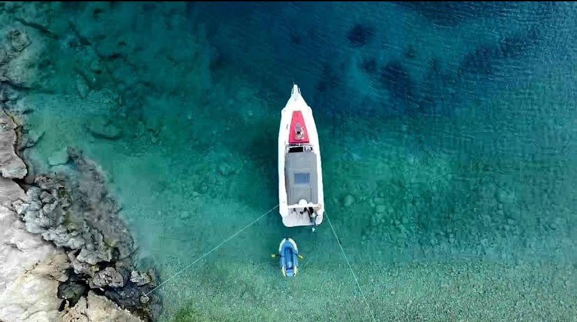 Aerial view of the Zen Explorer moored in clear water